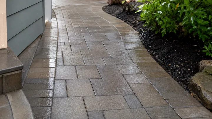 Paver walkway restored to a clean, even finish after pressure washing in Redmond, WA