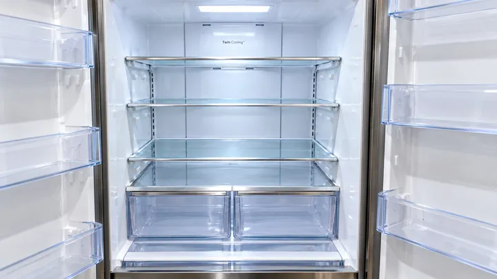 Refrigerator interior with spotless, streak-free shelves after a move-out clean in Bellevue, WA
