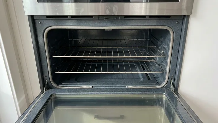 Oven interior scrubbed clean with no baked-on residue after a move-out clean in Kirkland, WA