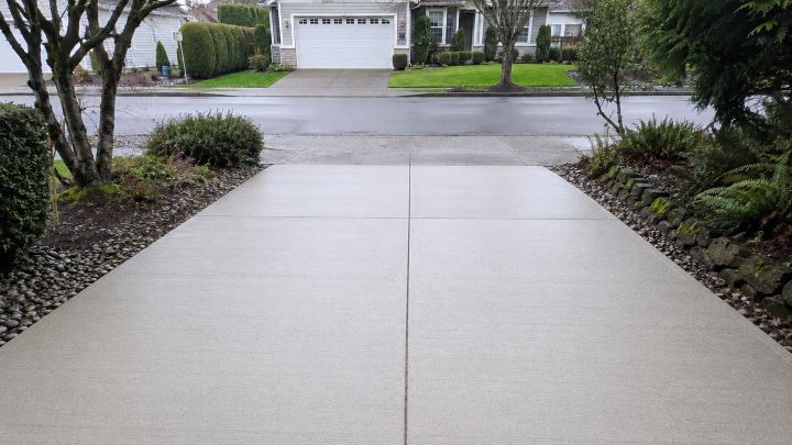 Clean, moss-free concrete driveway after pressure washing in Bellevue, WA