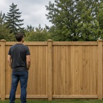 Standard height wood fence, about 5 feet tall