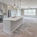 Kitchen covered in construction dust and debris after a remodel