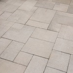 Paver patio with some dust and dirt before pressure washing